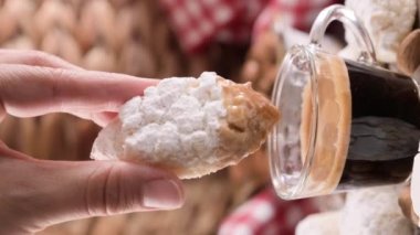 Sicilian Almond Cookies - Almond Pastes. Traditional dessert of the South of Italy and a cup of fragrant espresso on a wooden table. The atmosphere of an Italian village. 4k vertical video