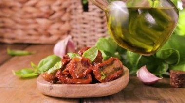 Dried tomatoes with herbs and olive oil. Traditional canned tomatoes in Italy with garlic, Provence herbs and basil. Ingredients for bruschetta and aperitif. High quality 4k footage