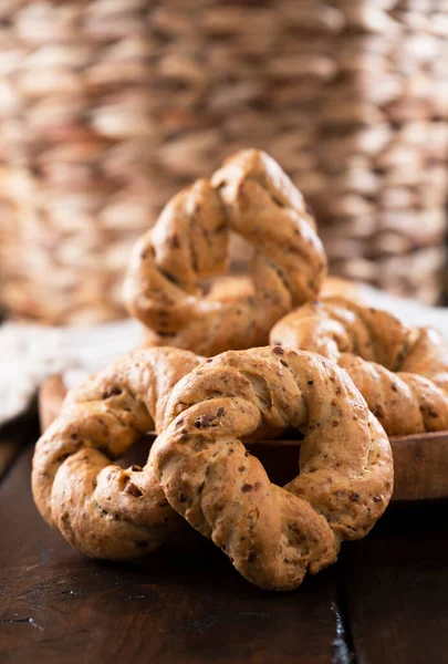 Taralli, a popular cheap snack, for sale in Naples, Italy. Neapolitan cookies called made with lard almond or black pepper.. Vertical view, for social networks and advertising