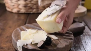 Pecorino cheese with truffle, traditional Italian sheeps milk cheese with truffle. A typical product of the dairy regions of Tuscany and Sardinia. High quality 4k footage