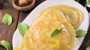 Seadas, traditional sardinian dessert with pecorino cheese, honey and lemon. Round meal with cheese, traditional in italy of the Sardinia region and south of italy. High quality footage