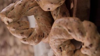Taralli, a popular cheap snack, for sale in Naples, Italy. Neapolitan cookies called made with lard almond or black pepper. High quality 4k footage. for social networks and advertising