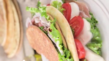 Spianata Sarda. Typical tortilla bread in italy Sardinia region. Baking bread Thin round with different flour. High quality footage. Vertical video