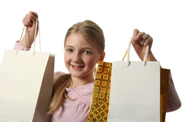 Menina bonita segurando sacos de compras — Fotografia de Stock