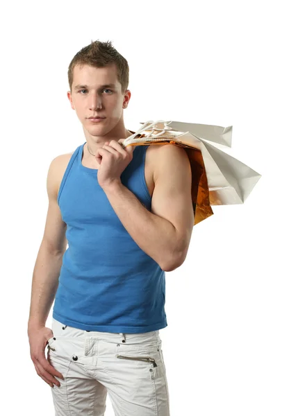 Jongeman met boodschappentassen — Stockfoto