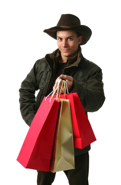 Hombre joven con bolsas de compras —  Fotos de Stock