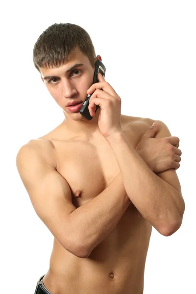 Мускулистый человек звонит по сотовому телефону — стоковое фото