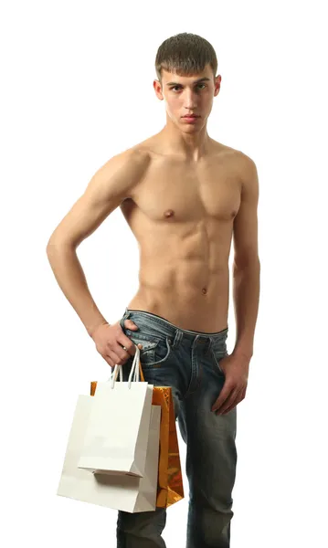 Junger sexy Mann mit Kopierraum-Einkaufstaschen — Stockfoto