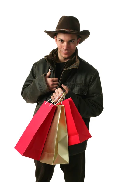 Hombre joven con bolsas de compras —  Fotos de Stock