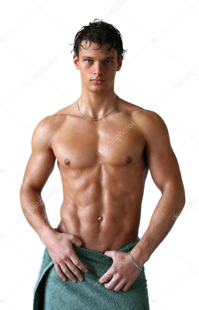 Wet Muscular Man Wrapped in a Towel Isolated on White