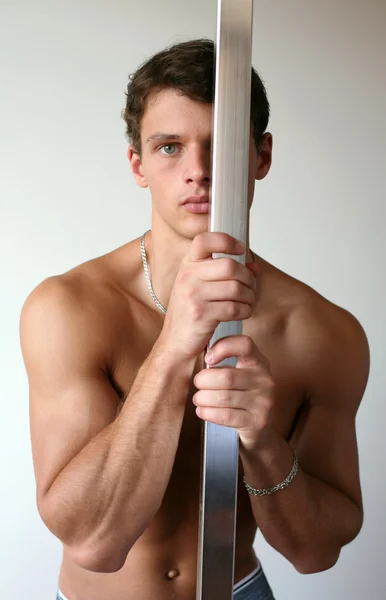 Sexy Man with a Pole — Stock Photo, Image