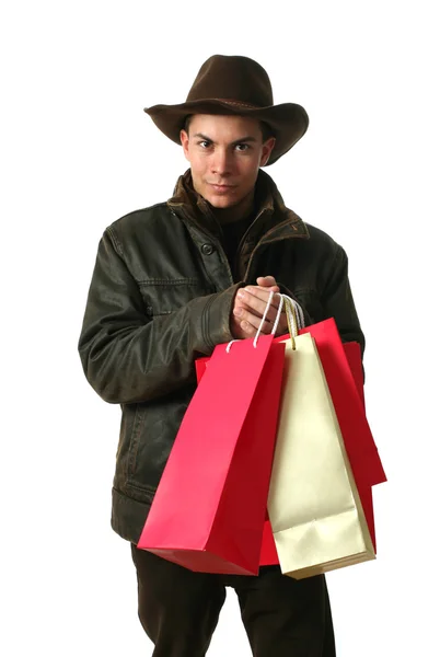 Jeune homme avec des sacs à provisions — Photo