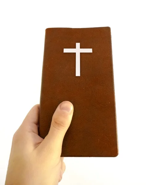Mão Segurando um Livro Cristão — Fotografia de Stock
