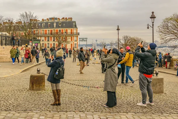 PARIS, FRANCE, JANUARY - 2020 - People taking photos at famous sacred heart church, paris, france