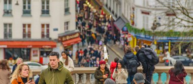 PARIS, FRANCE, JANUARY - 2020 - Crowd at sacred heart church viewpoint, paris, france