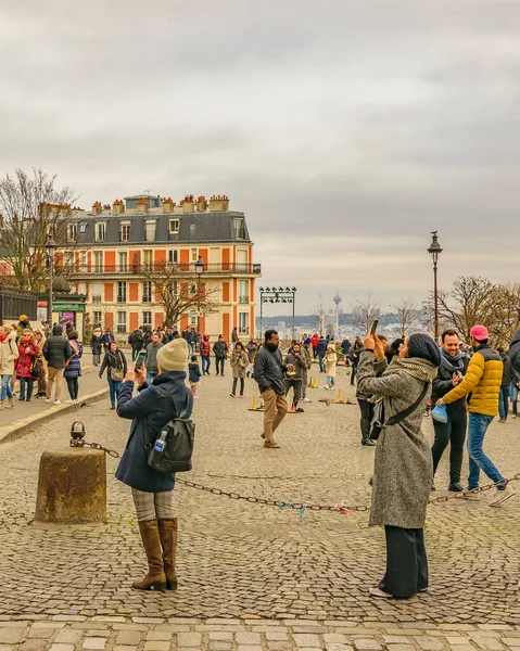 PARIS, FRANCE, JANUARY - 2020 - People taking photos at famous sacred heart church, paris, france