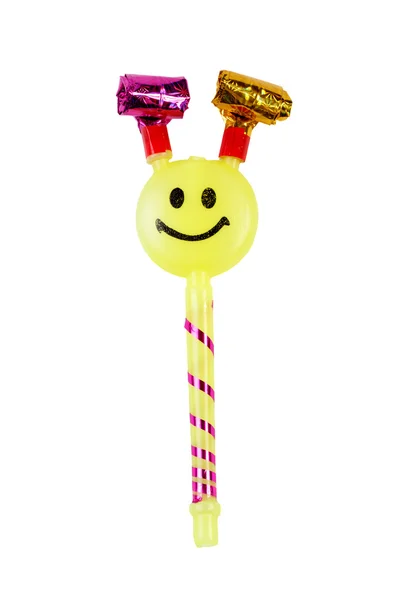 Yellow toy whistle with a smiley face isolated — 图库照片