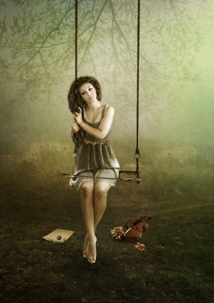 Young violinist on swing