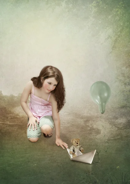 Girl and paper boat — Stock Photo, Image