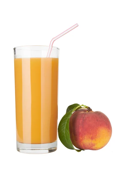 Свіжий персиковий сік у склянці — стокове фото