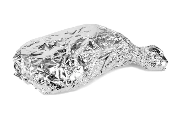 Chicken leg wrapped in aluminum foil — Stock Photo, Image