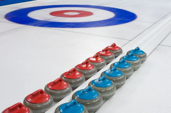 Curling-Steine lizenzfreie Stockbilder