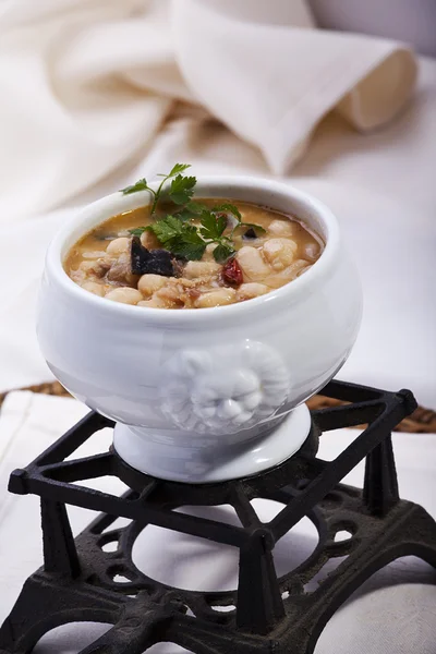 Beans cooked with mushrooms and quail Stock Picture