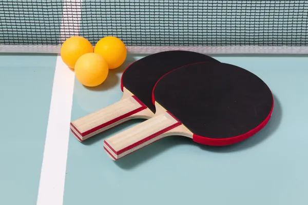 Table tennis rackets and balls — Stock Photo, Image