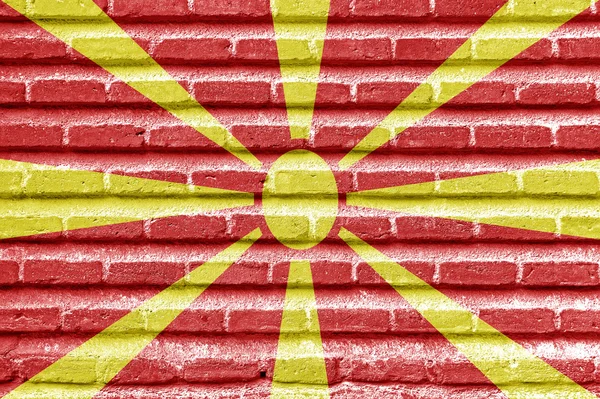 Vlajka Makedonie na starou cihlovou zeď — Stock fotografie