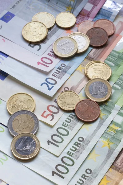 Euro banknotes and coins — Stock Photo, Image