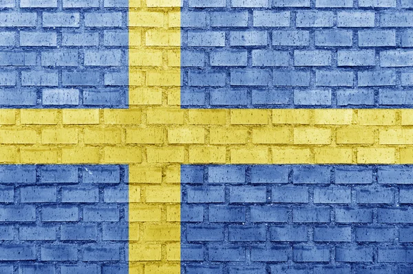 Σημαία της Σουηδίας, σε έναν τοίχο από τούβλα — Φωτογραφία Αρχείου