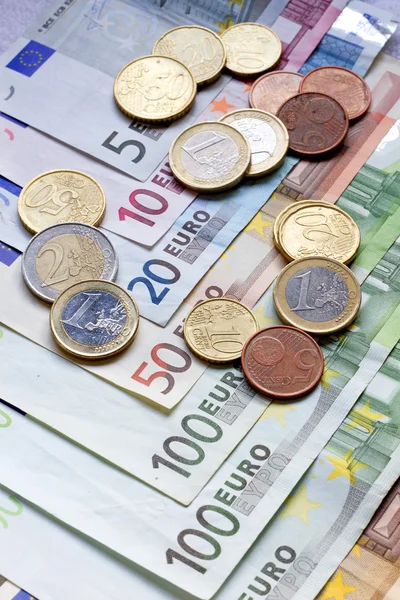 Euro banknotes and coins — Stock Photo, Image