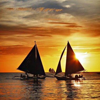 Sailing on sunset clipart