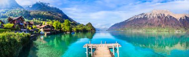 Stunning idylic nature scenery of mountain lake Brienz. Switzerland, Bern canton. Iseltwald village surrounded turquoise waters clipart