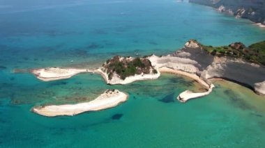 Ionian islands of Greece. aerial bird eye view of stunning Cape Drastis - natural beauty landscape with white rocks and turquoise waters, northern part of Corfu island.