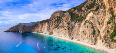 Greece, Ionian islands. Best beaches of Corfu.  impressive Paradise beach under huge rock. aerial drone view 