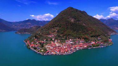 Italian lakes scenery. Iseo lake . Aerial drone view of beautiful Monte Isola island and Peschiera Maraglio village. Italy, Brescia province