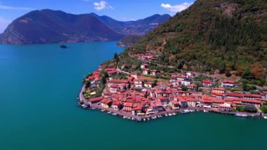 Italian lakes scenery. Iseo lake . Aerial drone view of beautiful Monte Isola island and Peschiera Maraglio village. Italy, Brescia province