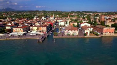  Scenic lake Lago di Garda. aerial video of Lazise- medieval village and castle. Italy, Verona province