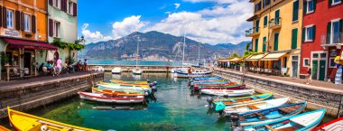Scenic Lake Lago di Garda, Italy, Charming fishing village with colorful houses and boats - Castelletto di Brenzone. 28/07/2022