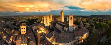 San Gimignano - one of the most beautiful medieval towns in Tuscany, Italy.  aerial view of towers over sunset. 