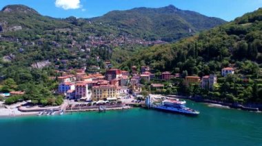 One of the most beautiful lakes of Italy - Lago di Como. aerial drone video of beautiful Varenna village, popular tourist attraction