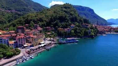 One of the most beautiful lakes of Italy - Lago di Como. aerial drone video of beautiful Varenna village, popular tourist attraction
