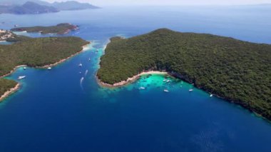 Sivota - stunning aerial view of turquoise sea known as Blue Lagoon and unique beach Bella Vraka. Epirus, Greece aerial drone video