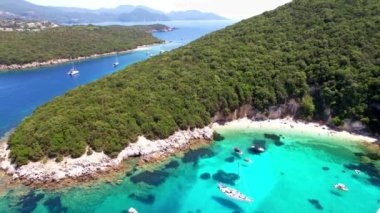 Sivota - stunning aerial view of turquoise sea known as Blue Lagoon and unique beach Bella Vraka. Epirus, Greece aerial drone video