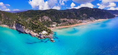 Greece summer holidays. Best scenic beaches of Corfu island - aerial panoramic view of Glyfada beach and village in western part clipart