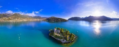 Amazing lake Iseo scenery with picturesque small island Loreto with castle, aerial drone view. Italy, Brescia province