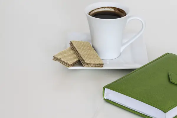 Cup of tea with notebook — Stock Photo, Image