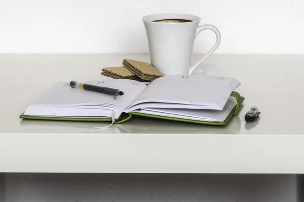 Tasse de thé avec carnet — Photo