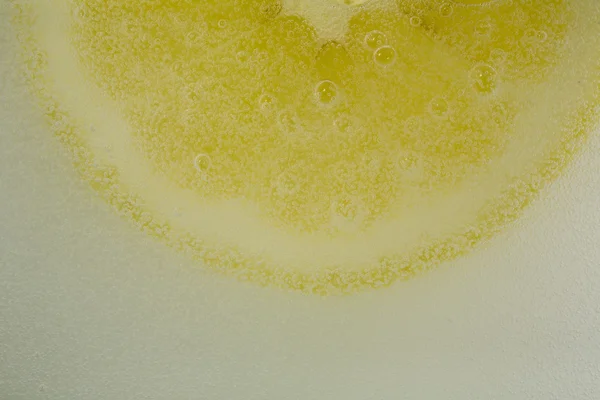 Lemon in the bubbles — Stock Photo, Image